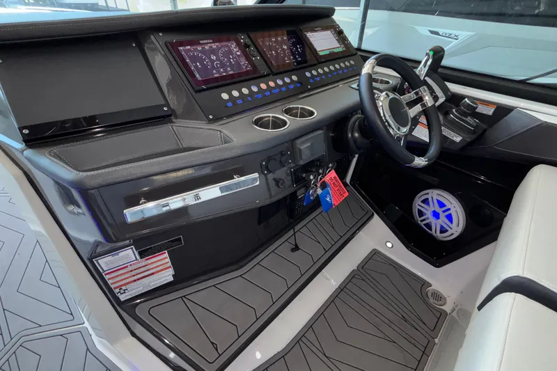 Slide: The Image of 2023 Monterey 385SS Super Sport boat dashboard with modern controls and steering wheel. - 36