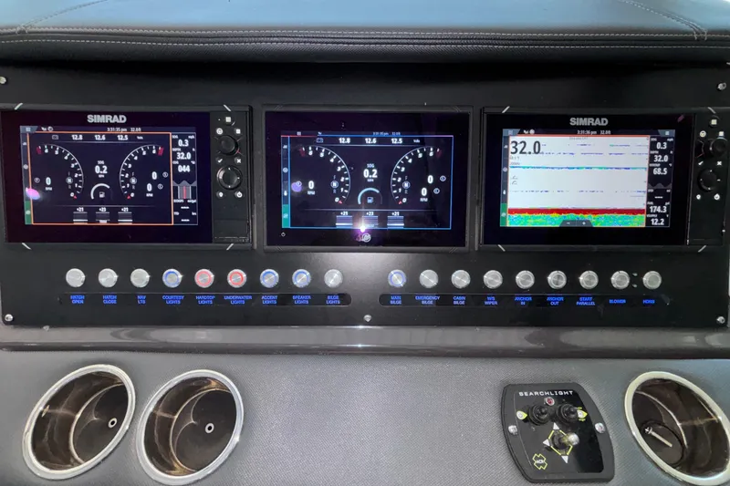 Slide: The Image of Dashboard of 2023 Monterey 385SS Super Sport with Simrad displays and control buttons. - 40
