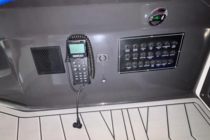 Slide: The Image of Control panel of 2023 Monterey 385SS Super Sport boat with radio and switches. - 47