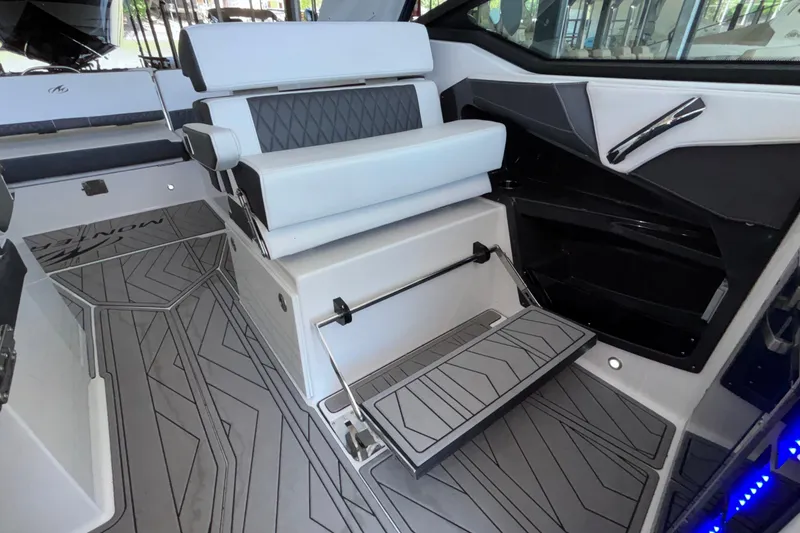 Slide: The Image of 2023 Monterey 385SS Super Sport boat interior with modern seating and sleek design. - 51