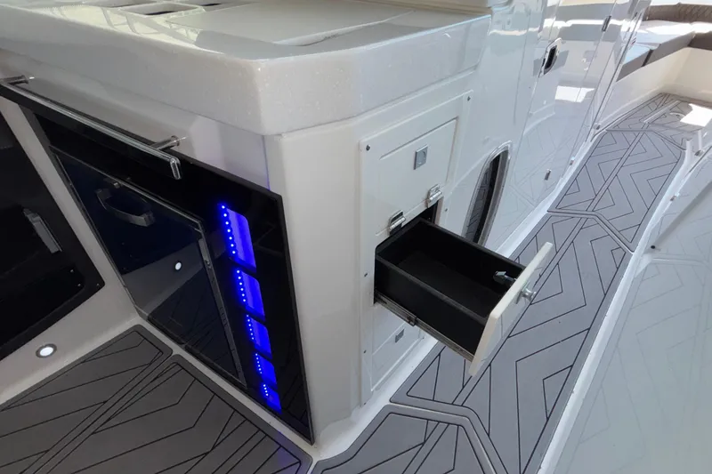 Slide: The Image of 2023 Monterey 385SS Super Sport boat interior with sleek storage and modern design. - 57