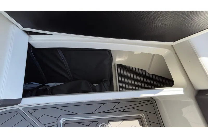 Slide: The Image of Storage compartment in 2023 Monterey 385SS Super Sport boat, featuring sleek interior design. - 68