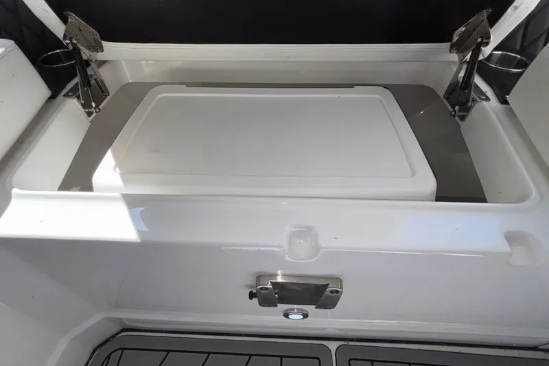 Slide: The Image of 2023 Monterey 385SS Super Sport boat storage compartment with stainless steel hinges. - 69
