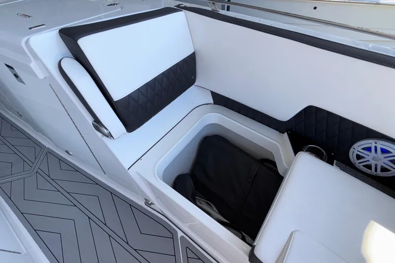 Slide: The Image of 2023 Monterey 385SS Super Sport boat interior with storage compartment and speaker. - 72