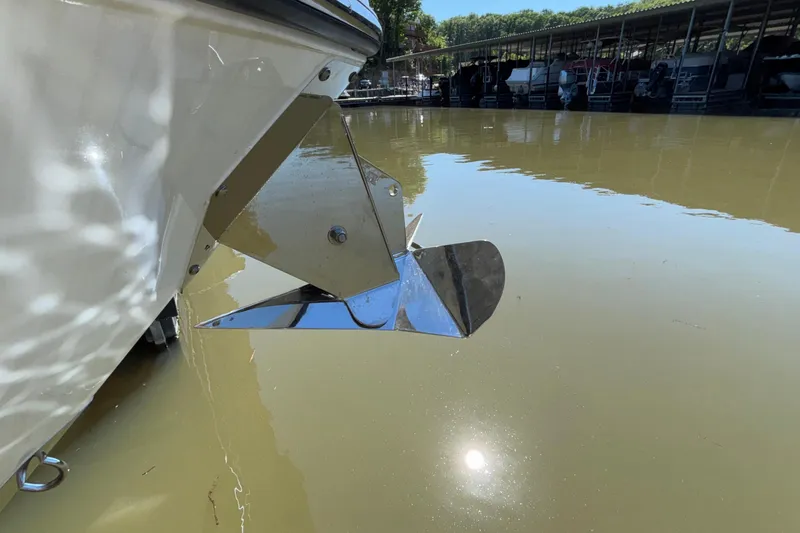Slide: The Image of 2023 Monterey 385SS Super Sport boat anchor in calm marina waters. - 75