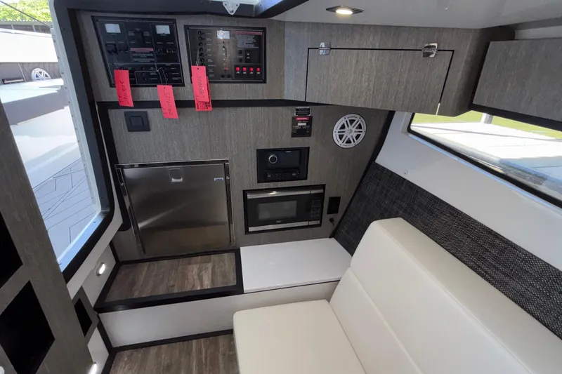 Slide: The Image of Interior of 2023 Monterey 385SS Super Sport boat with modern amenities and sleek design. - 77