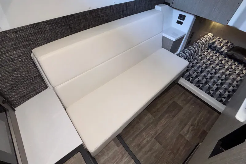 Slide: The Image of Interior of 2023 Monterey 385SS Super Sport with modern seating and geometric-patterned bedding. - 78