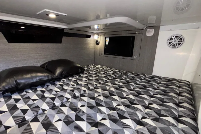 Slide: The Image of 2023 Monterey 385SS Super Sport cabin with geometric-patterned bedding and modern interior design. - 81