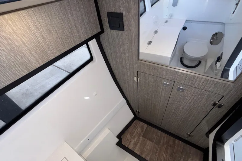 Slide: The Image of Interior of 2023 Monterey 385SS Super Sport boat, featuring modern bathroom design. - 88