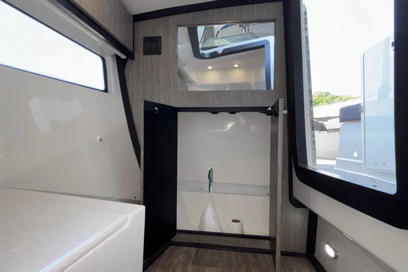 Slide: The Image of Interior of 2023 Monterey 385SS Super Sport boat with storage compartment open. - 92