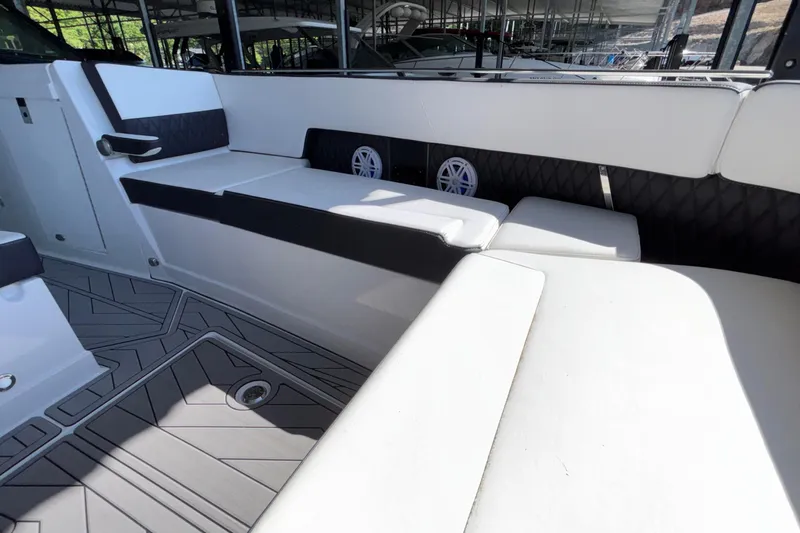 Slide: The Image of 2023 Monterey 385SS Super Sport boat interior with sleek seating and modern design. - 94