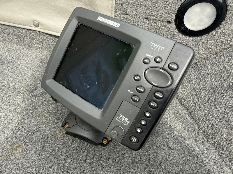 Slide: The Image of Humminbird GPS device on Alumacraft Navigator 175 CS boat. - 12