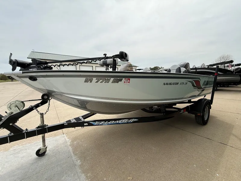 Slide: The Image of 2010 Alumacraft Navigator 175 CS boat on trailer. - 2