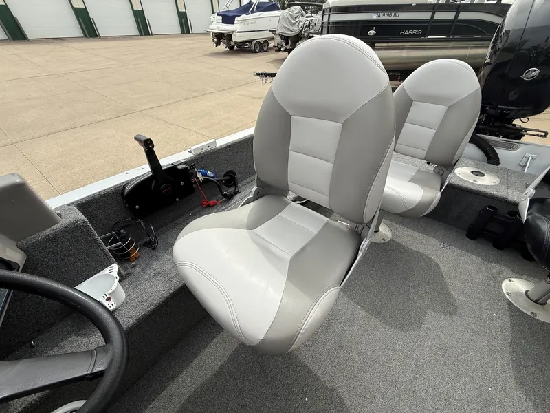 Slide: The Image of Interior of a 2010 Alumacraft Navigator 175 CS boat with gray seats. - 25