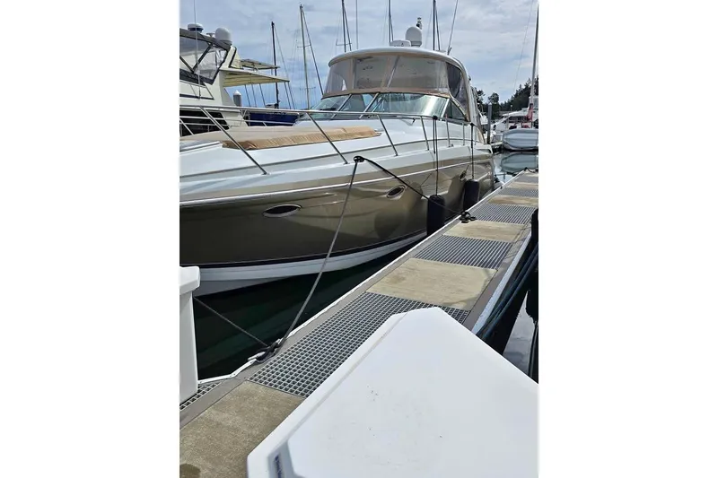 Slide: The Image of 2008 Formula 40 Performance Cruiser docked at marina, showcasing sleek design and luxury features. - 4