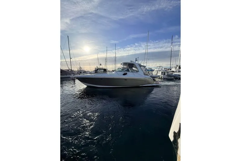 Slide: The Image of 2008 Formula 40 Performance Cruiser in marina at sunset, surrounded by other boats. - 5