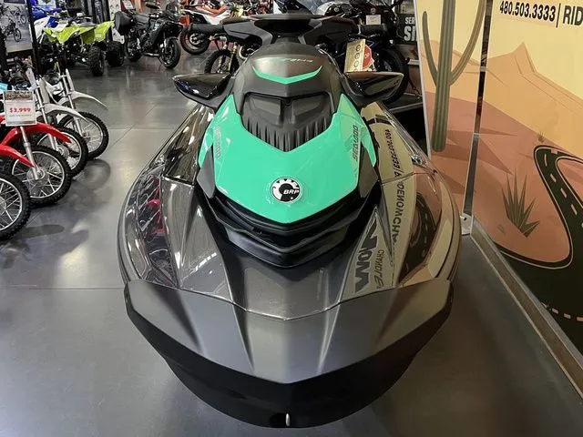 Slide: The Image of 2026 Sea-Doo GTI SE 130 jet ski in a showroom. - 3