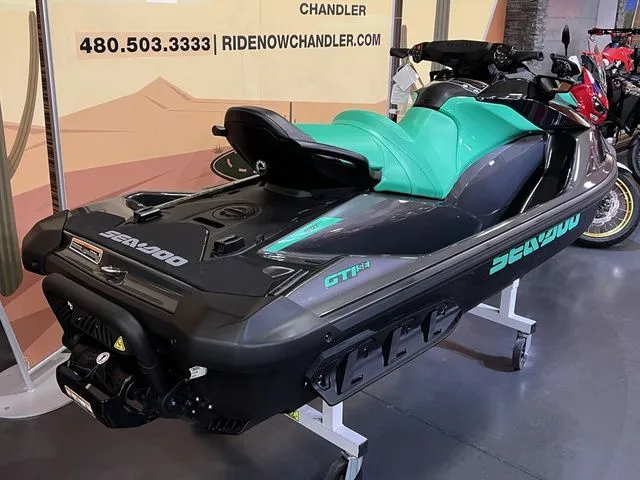 Slide: The Image of 2026 Sea-Doo GTI SE 130 jet ski in showroom. - 4