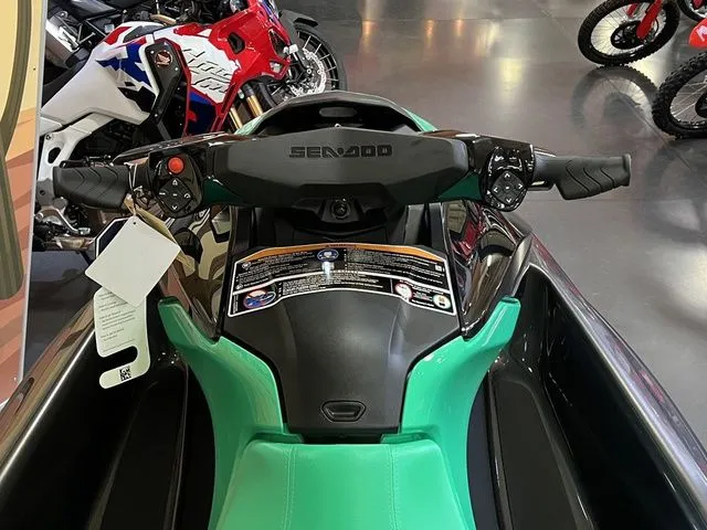 Slide: The Image of 2026 Sea-Doo GTI SE 130 jet ski with green seat and black handlebars. - 6