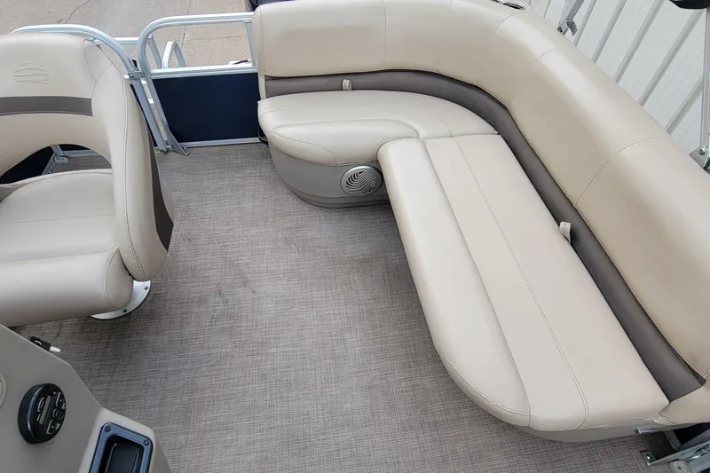 Slide: The Image of 2020 SUNTRACKER BASS BUGGY 16 XLS pontoon boat interior with beige seating. - 10