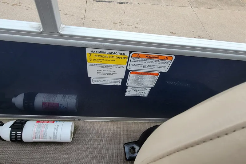 Slide: The Image of 2020 SUNTRACKER BASS BUGGY 16 XLS capacity and warning labels with fire extinguisher. - 13