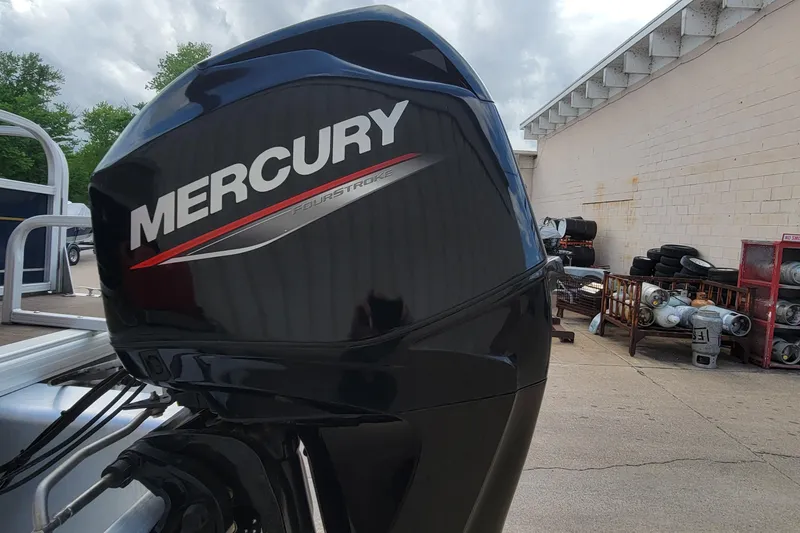 Slide: The Image of Mercury FourStroke engine on 2020 SUNTRACKER BASS BUGGY 16 XLS boat, outdoor setting. - 6
