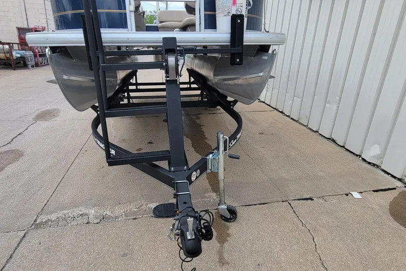 Slide: The Image of 2020 SUNTRACKER BASS BUGGY 16 XLS pontoon boat on trailer, parked on concrete. - 9