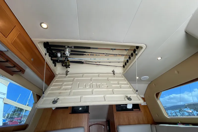 Slide: The Image of Interior view of 2003 Luhrs 34 Convertible boat with fishing rod storage. - 22