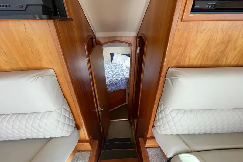 Slide: The Image of Interior view of 2003 Luhrs 34 Convertible yacht, featuring cozy cabin and seating. - 26