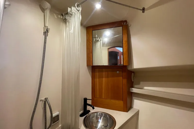 Slide: The Image of Bathroom interior of 2003 Luhrs 34 Convertible yacht with shower and sink. - 28