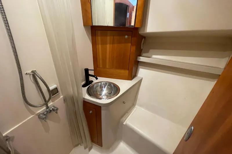 Slide: The Image of Bathroom interior of 2003 Luhrs 34 Convertible yacht with sink and shower. - 29