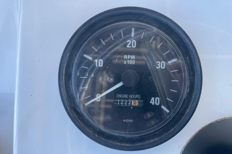 Slide: The Image of Tachometer displaying RPM and engine hours on 2003 Luhrs 34 Convertible boat. - 39