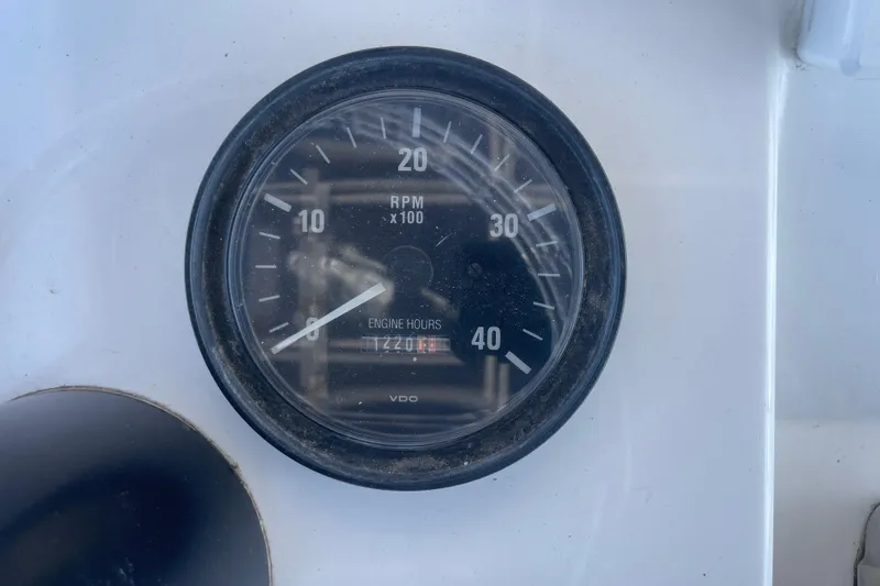 Slide: The Image of Close-up of a 2003 Luhrs 34 Convertible tachometer showing RPM and engine hours. - 40
