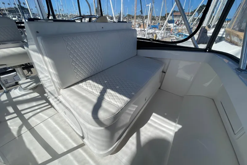 Slide: The Image of Luxurious seating on 2003 Luhrs 34 Convertible yacht, featuring diamond-stitched upholstery. - 45