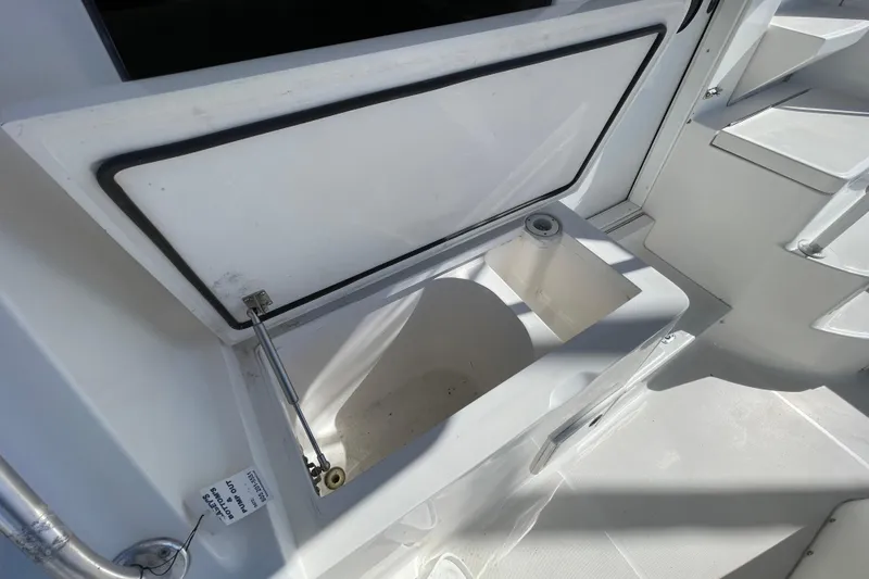 Slide: The Image of Open storage compartment on 2003 Luhrs 34 Convertible boat deck. - 7