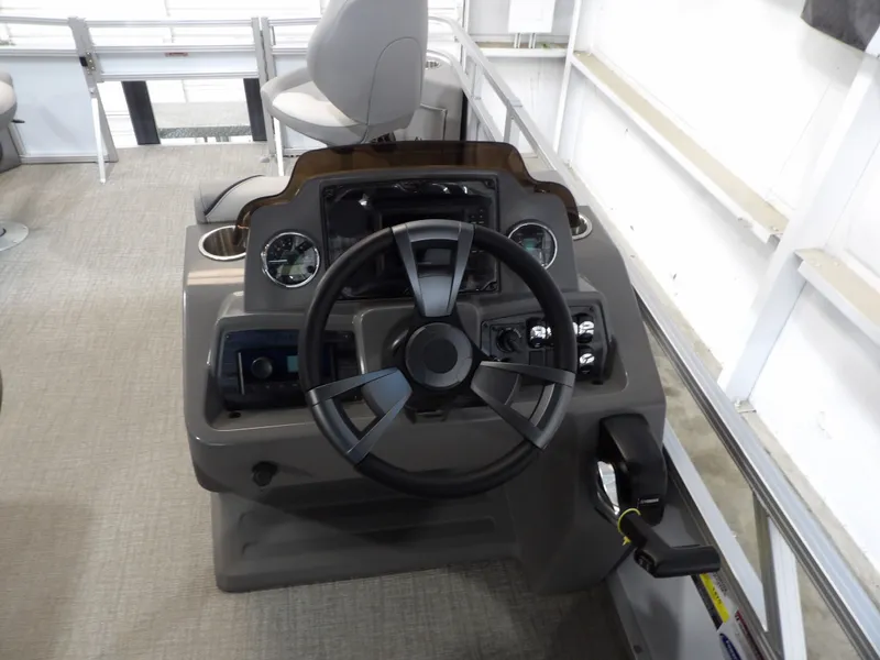 Slide: The Image of Steering console of the 2026 Avalon Venture Quad Fish pontoon boat. - 19