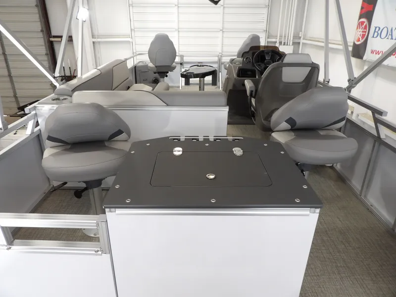 Slide: The Image of Interior of 2026 Avalon Venture Quad Fish with gray seating. - 24
