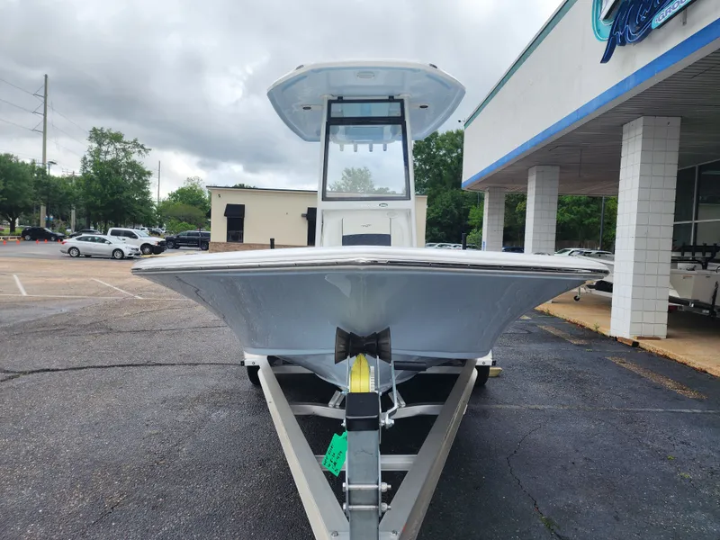 Slide: The Image of 2026 Tidewater 2210 Carolina Bay boat on trailer outside a building. - 5
