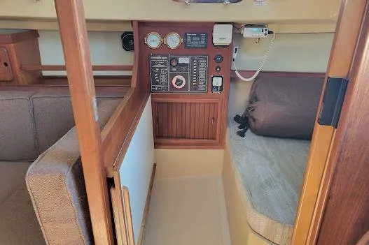 Slide: The Image of NAV STATION INCORPORATED INTO THE QUARTHER BERTH. NOTE NAV TABLE FOLDED AGAINST BULKHEAD - 11
