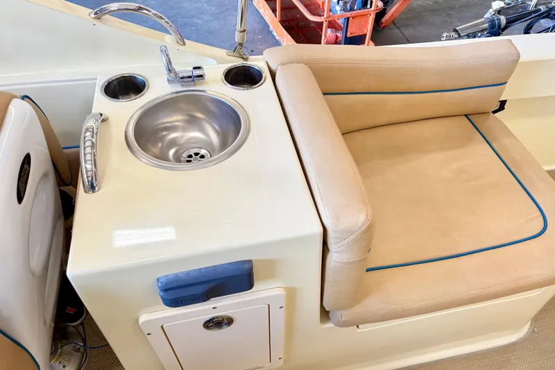 Slide: The Image of Interior of 2018 Vanquish Bristol Harbor 23 boat with sink and cushioned seating. - 11