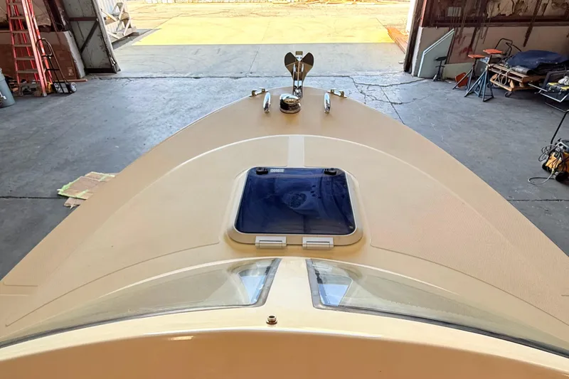 Slide: The Image of 2018 Vanquish Bristol Harbor 23 boat in a warehouse, viewed from the bow. - 12