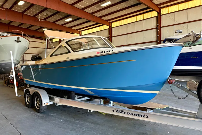 Slide: The Image of 2018 Vanquish Bristol Harbor 23 boat on trailer in indoor storage facility. - 3
