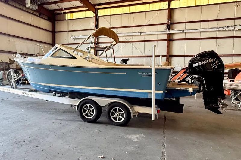 Slide: The Image of 2018 Vanquish Bristol Harbor 23 boat on trailer in warehouse setting. - 4