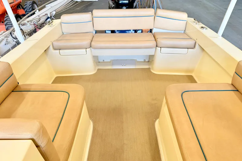 Slide: The Image of Interior of 2018 Vanquish Bristol Harbor 23 boat with beige seating and spacious layout. - 9