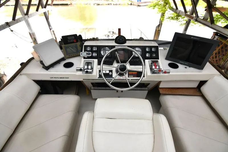 Slide: The Image of Cockpit of 1993 Bayliner 3288 Motoryacht with steering wheel and navigation equipment. - 15
