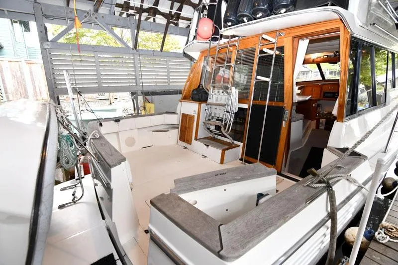 Slide: The Image of 1993 Bayliner 3288 Motoryacht interior with spacious deck and wooden accents. - 3