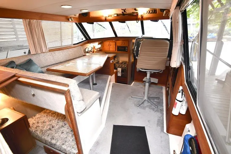 Slide: The Image of Interior of a 1993 Bayliner 3288 Motoryacht with seating and helm station. - 5