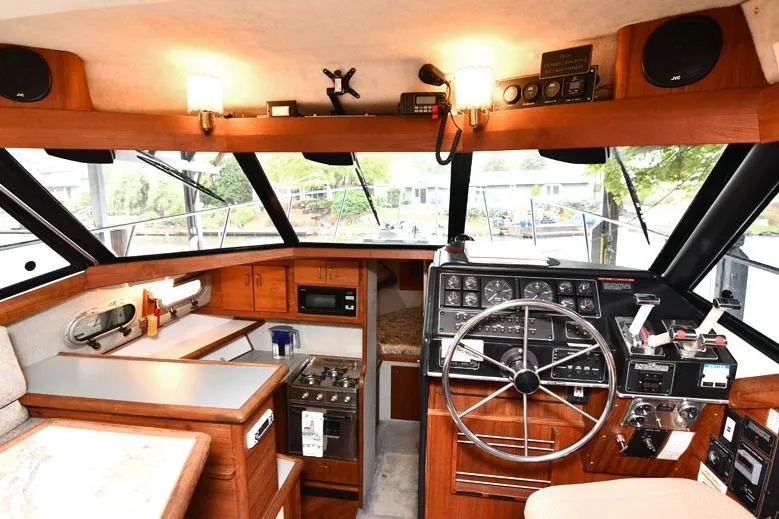 Slide: The Image of Interior of 1993 Bayliner 3288 Motoryacht with helm, kitchen, and navigation equipment. - 7