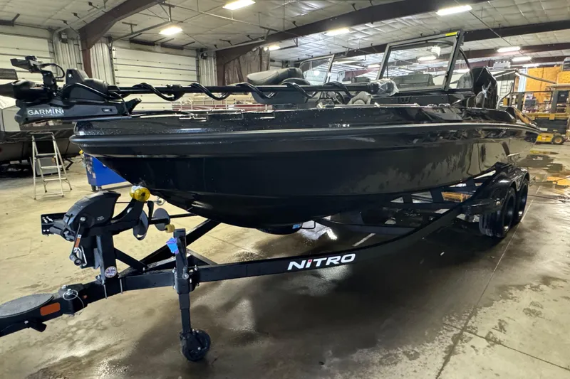 Slide: The Image of 2026 Nitro ZV21 Pro boat in a warehouse, featuring Garmin equipment. - 1
