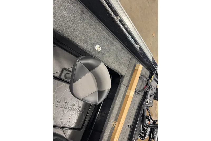 Slide: The Image of Interior of 2026 Nitro ZV21 Pro boat with seat and measuring ruler. - 10